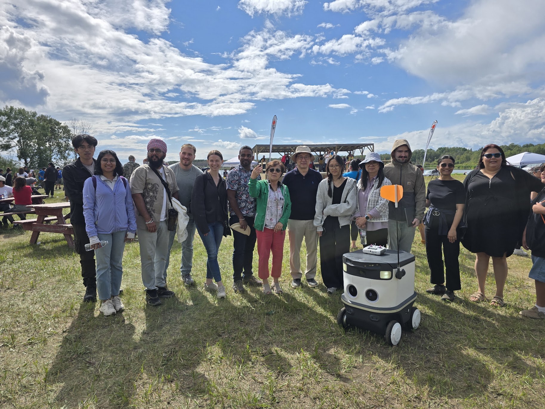 SMART CREATE team with the delivery robot at Opaskwayak Cree Nation